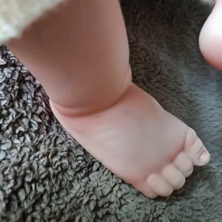 Lalka reborn Loulo, przytulna lalka noworodek z złotymi włosami.
